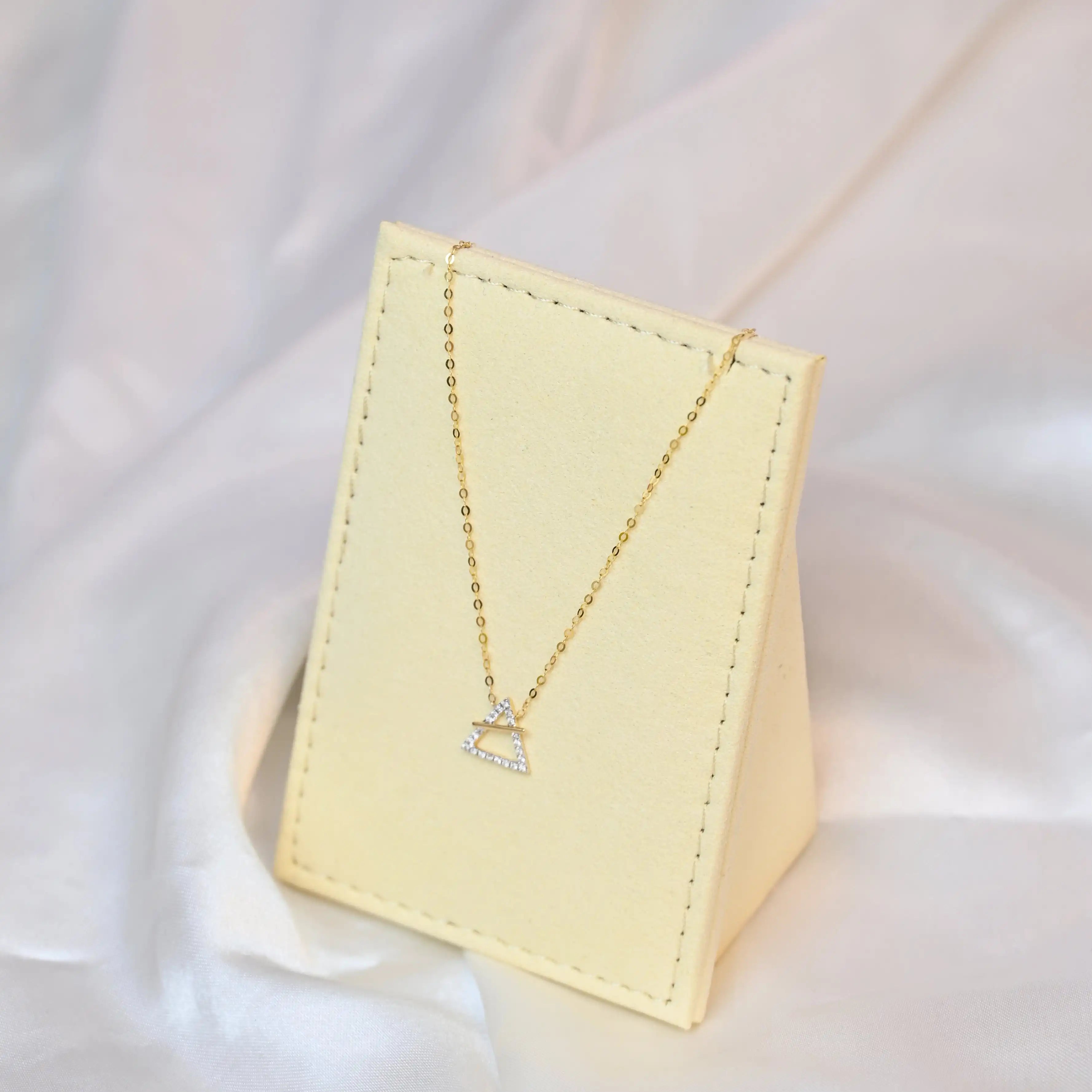 18K yellow gold necklace with crossed triangle diamond pendant – minimalist geometric gold jewelry for women