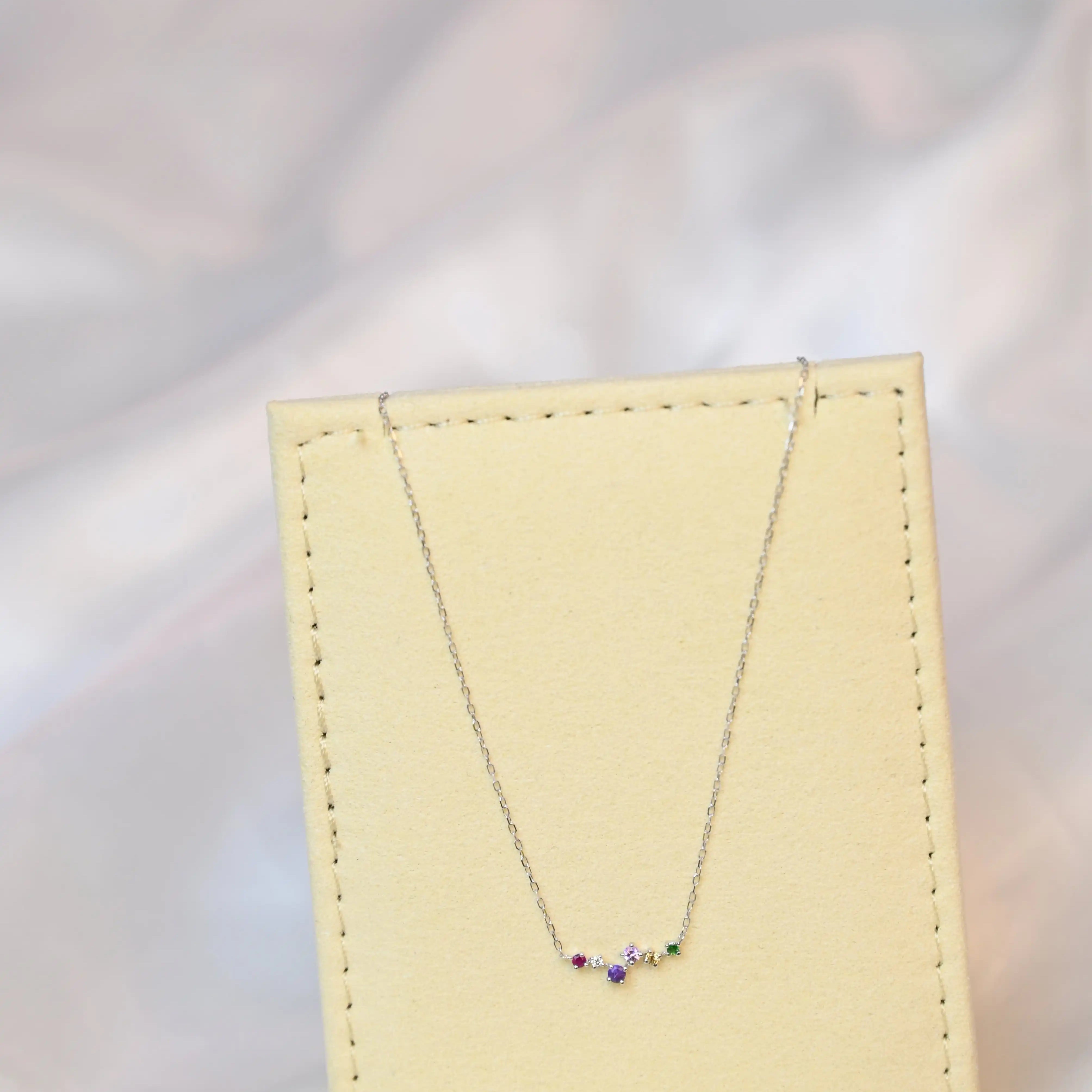 Devina Multi-Gem Diamond Necklace on a jewelry display