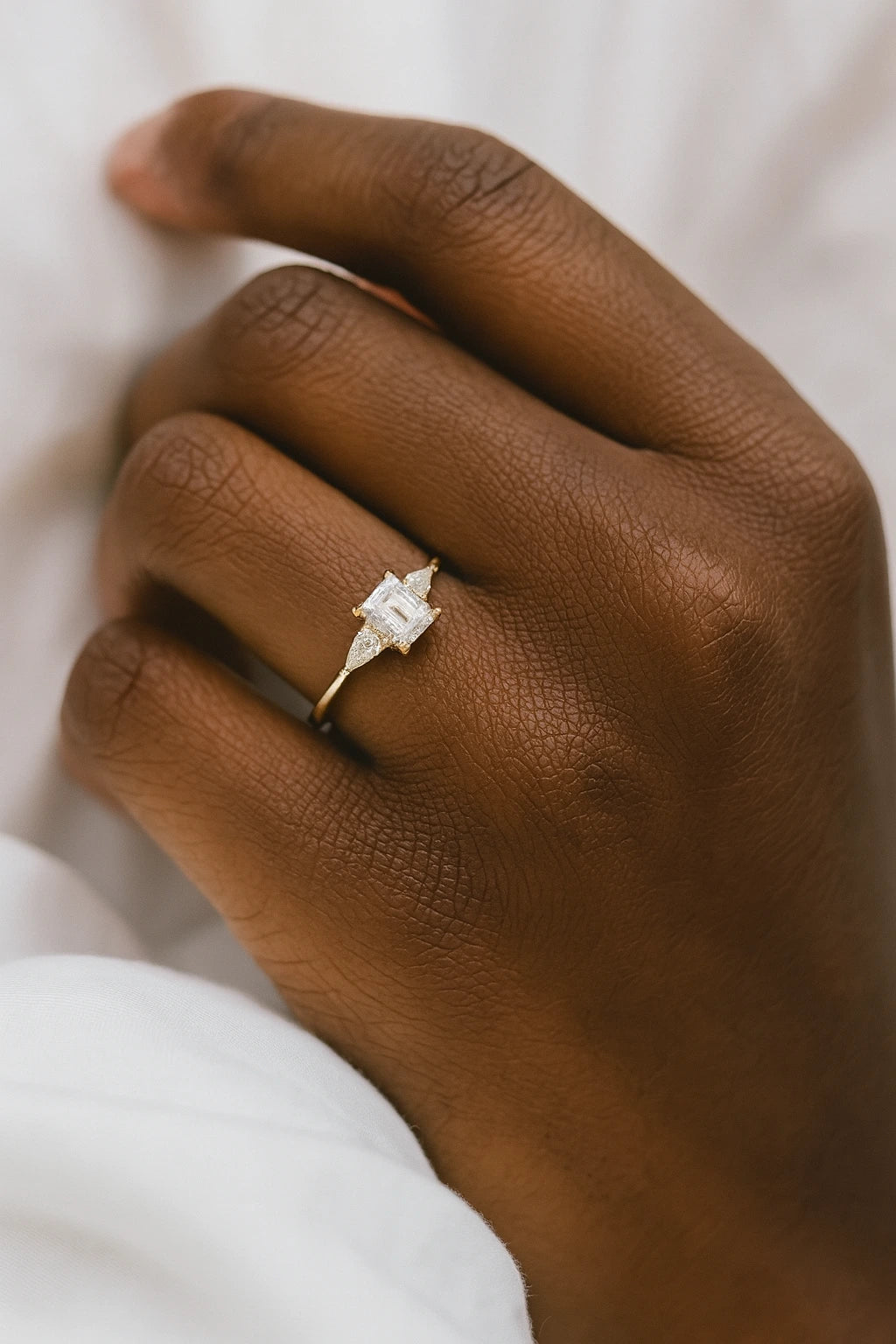 model wearing 14K gold haggith wedding band