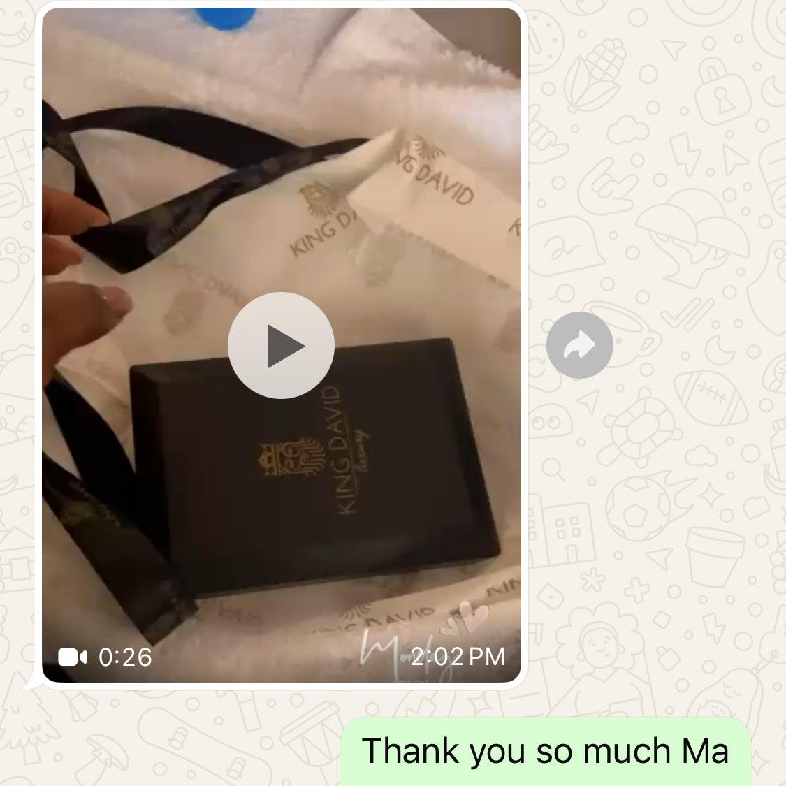 Text conversation with a video of a handbag and wallet.