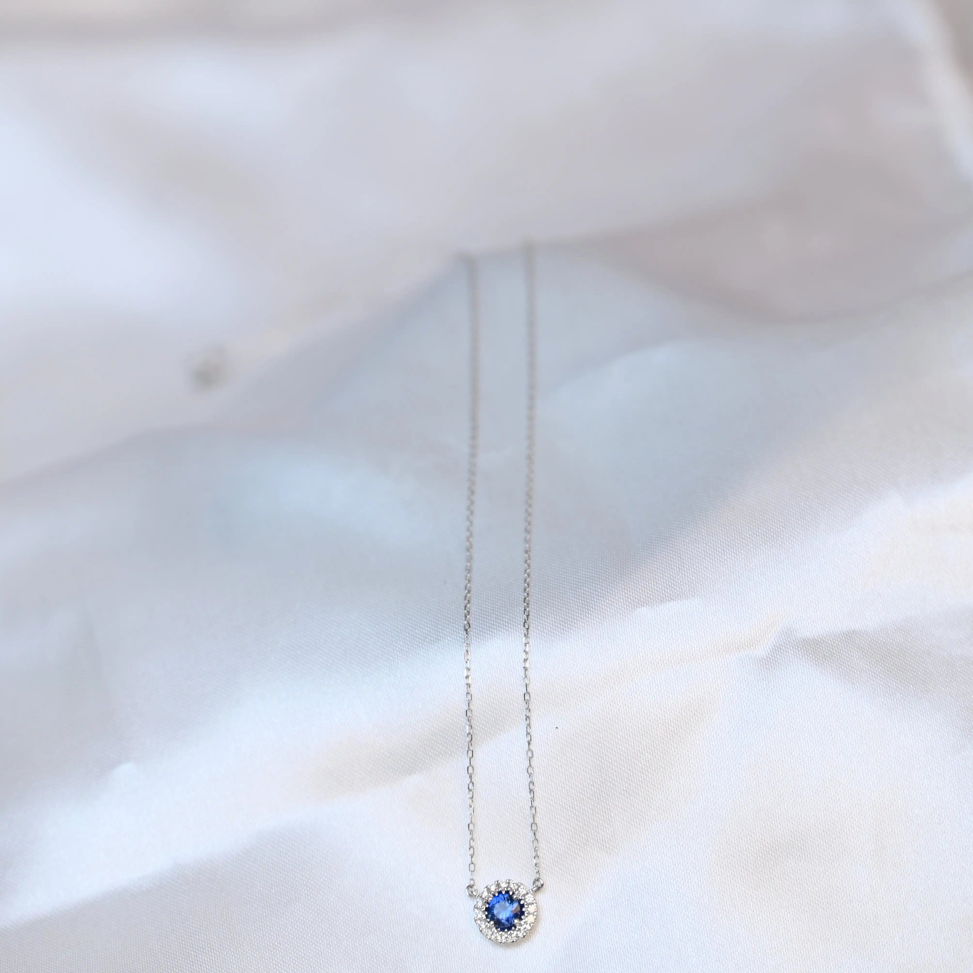 Michal Royalty Sapphire Necklace - King David sitting on a silk cloth background