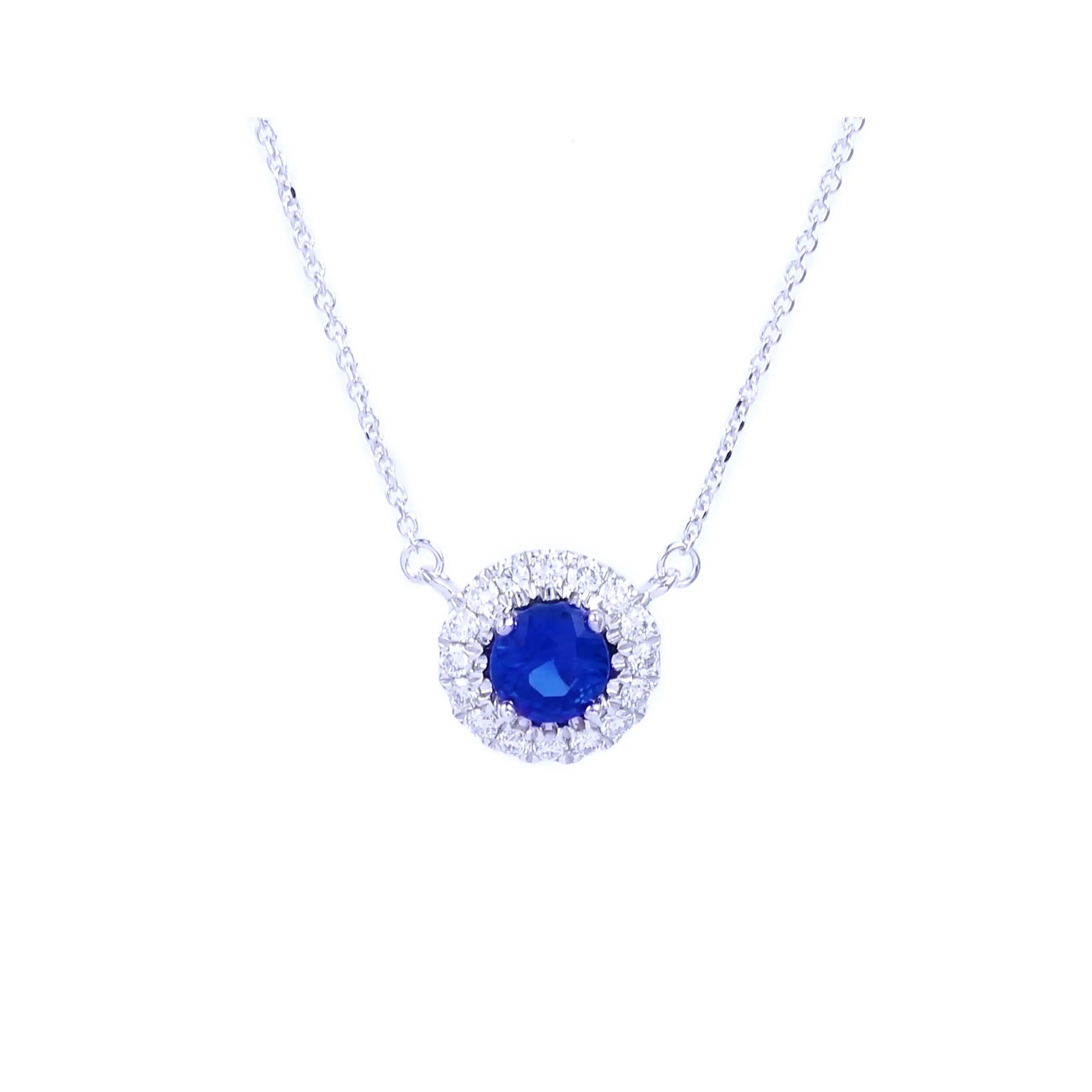 Elegant white gold necklace featuring a royal blue sapphire center stone surrounded by a halo of round-cut diamonds – Michal necklace.