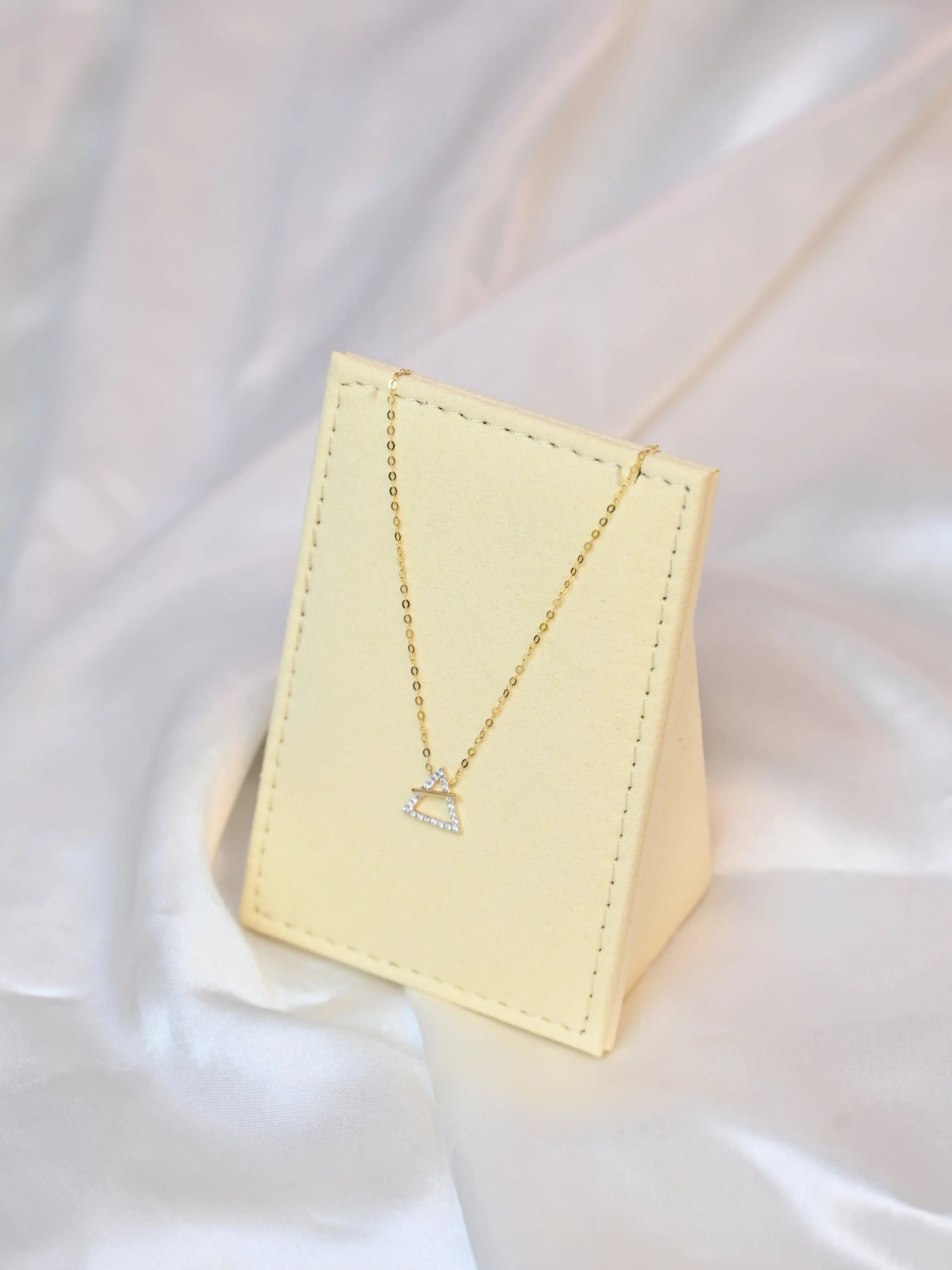 18K yellow gold necklace with crossed triangle diamond pendant – minimalist geometric gold jewelry for women
