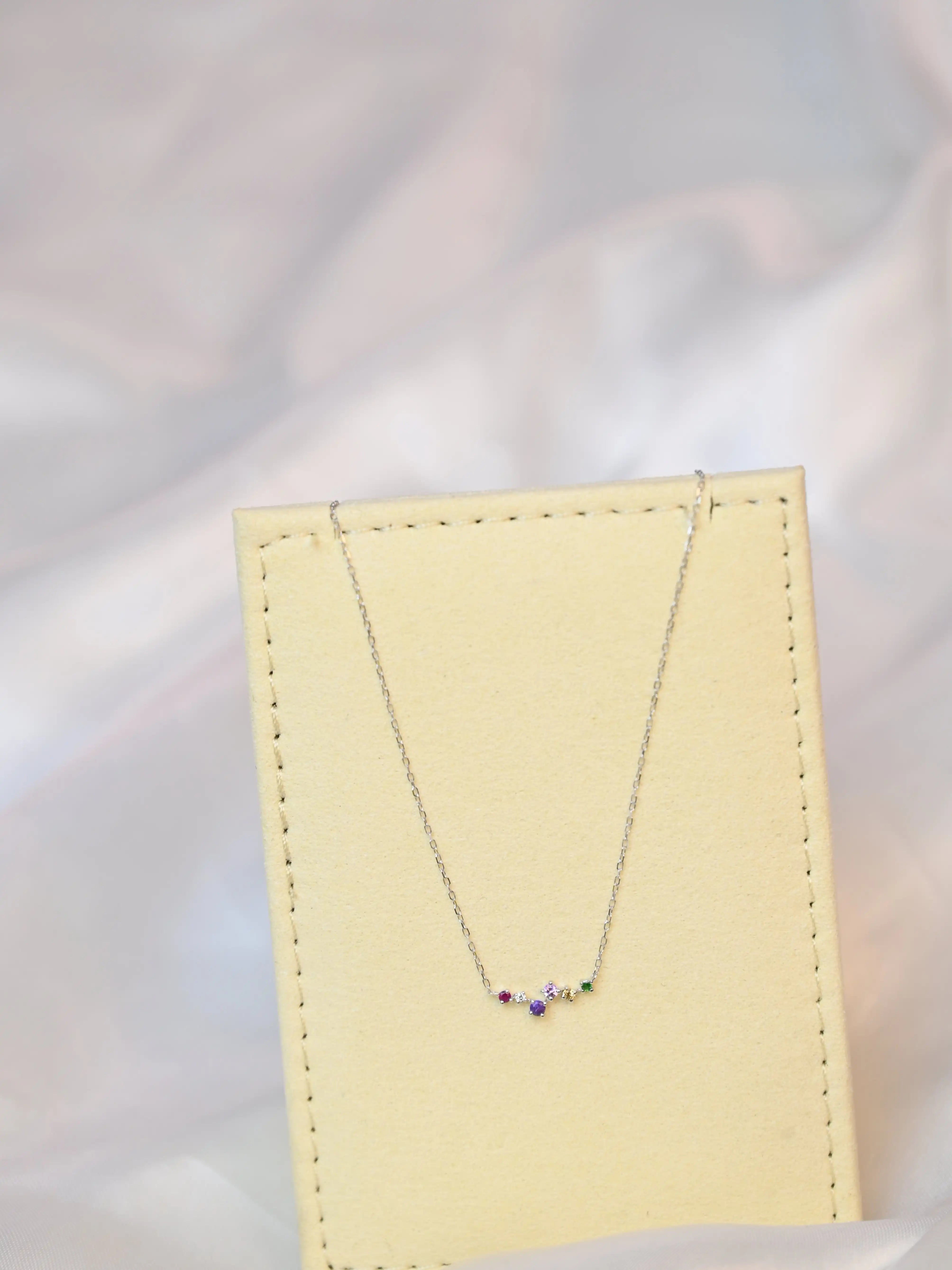 Devina Multi-Gem Diamond Necklace on a jewelry display